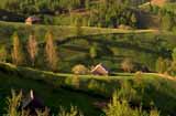 Hills and house in between the Bucegi Mountains.