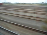 Prolonged exposure of railways (railroads) taken on train from Budapest to Bucharest, at the border.