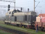 Photo taken from the train, of posing Romanian train engineers at the border.