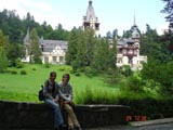 uke and Mariana with the Peles Castle in the background.