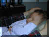 20000114 Nathan Sleeping on Mom's lap.jpg (48337 bytes)