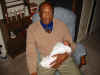 Grandpa Holding Jr in Chair.jpg (78499 bytes)