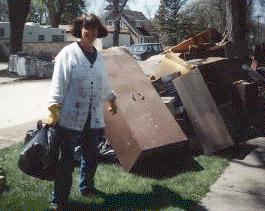 Jane hauling out stuff that was ruined by the floodwater