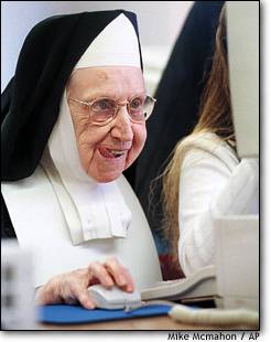 Picture of a nun checking out the internet