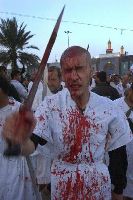 A Shiite Muslim beats his head with a sword and bleeds for Allah.