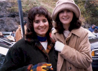 Heather and Amy keeping warm on the cold, rainy day.