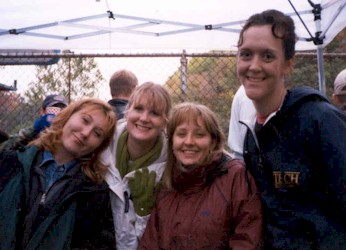 Tammy, Amy K, Heather and Sara find shelter under the AST tent.