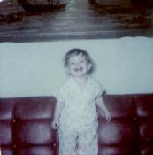 Ah, the hideous orange plastic couch we had. I remember it well, and I spent hours in that painting over the couch.