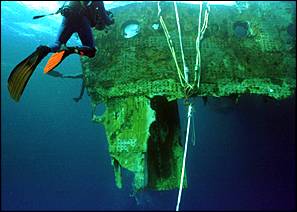 Divers prepare the Big Piece to be hauled aboard the Abeille on Monday, August 10