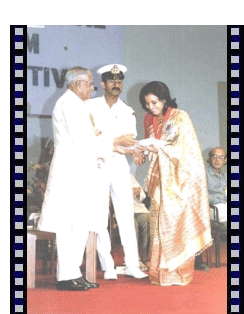 Moloya Goswami receiving the best actress award from President R Venkataraman for her role in Firingoti