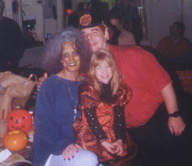 Chief Judge of the 1998 FFH Hallowe'en Party, with the lovely Debbie and Savannah