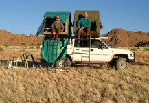 Camping by the side of the road, not all that far from Etosha:  Doreen (our friend from England who traveled with us most of the way) and Marc, atop the rented Toyota Hilux--enjoying the view from way up there.     CLICK HERE TO SEE THE LARGER VERSION OF THIS PHOTO