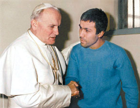 Pope John Paul II meets with his would-be assassin Mehmet Ali Agca.