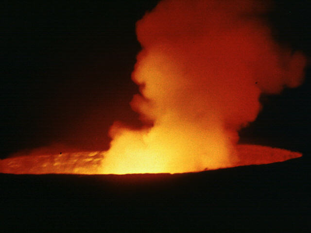 SMOKE AND FIRE RISING FROM A VOLCANO