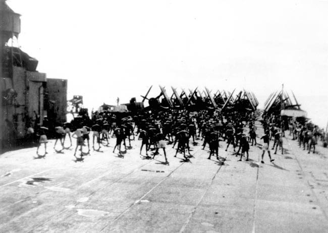 Early morning callisthenics on board HMS Glory