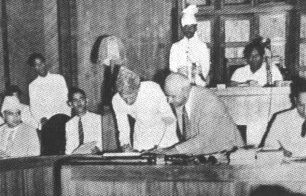 Quaid-e-Azam signing papers