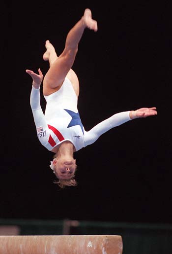 Shannon Miller soars high above the balance beam.