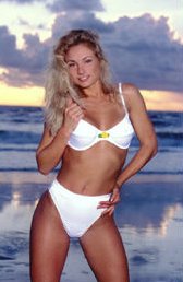 Heather in bright white bikini in front of the sea