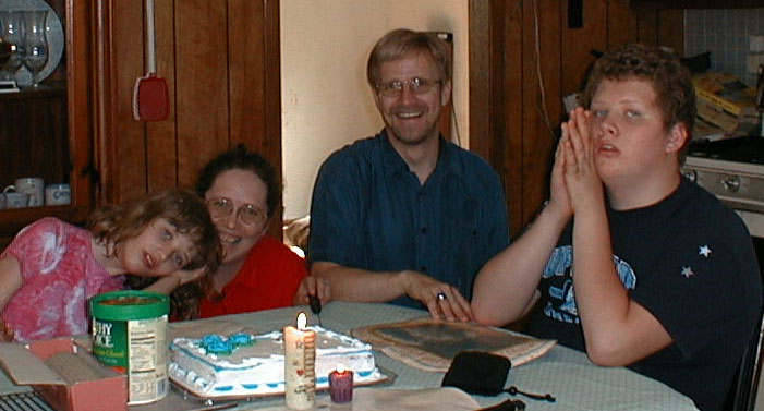 The Autistic Family on Kate's 10th, May 23, 2001; taken by Christie Walker.  We always look like rock band members when someone takes our picture.