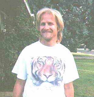 Probably the last picture of Jeff with long hair.  It's back to military cuts. Too old for long hair to be considered anything but pathetic.  (Notice the budding middle-age spread he didn't completely succeed in cropping out.)  August, 1998