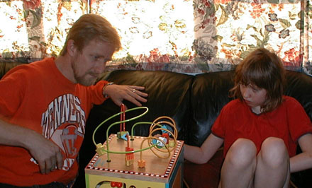 Jeff and Kate with Kate's new toy, December 25, 2001