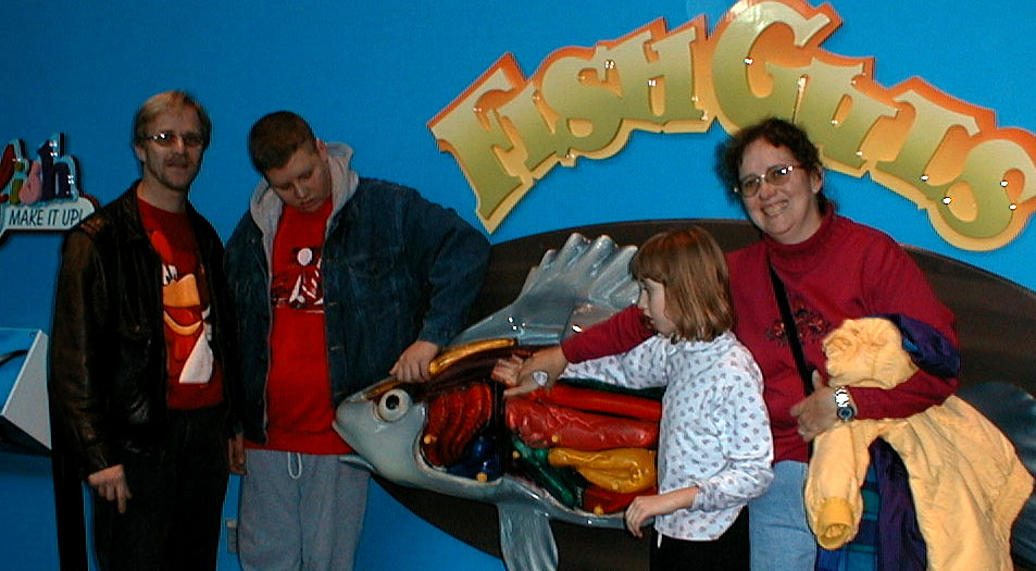 The autistic family at the fish guts display; Ripley's Aquarium of the Smokies visit, December 20, 2000:  picture taken by Carl Blier