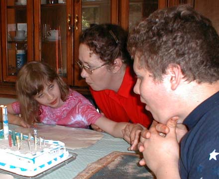 Kate getting some help with the candles on her 10th, May 23, 2001