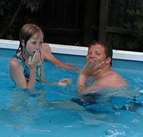 Kate and Luke in Aunt Terry and Uncle Paul's pool, July 29, 2001