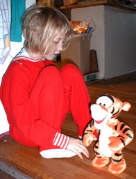 Kate not quite ready to bounce with Tigger on Christmas morning, 1998