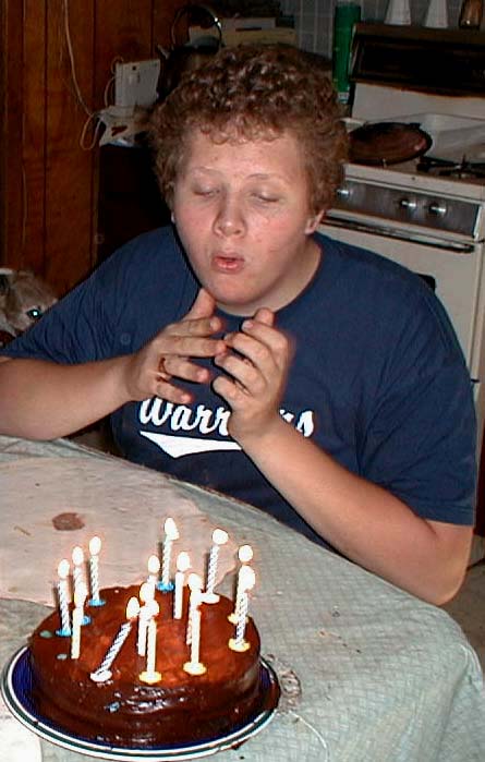 Luke blowing them out (and over!) as he turns 15, Se
ptember 11 (a day early), 2001