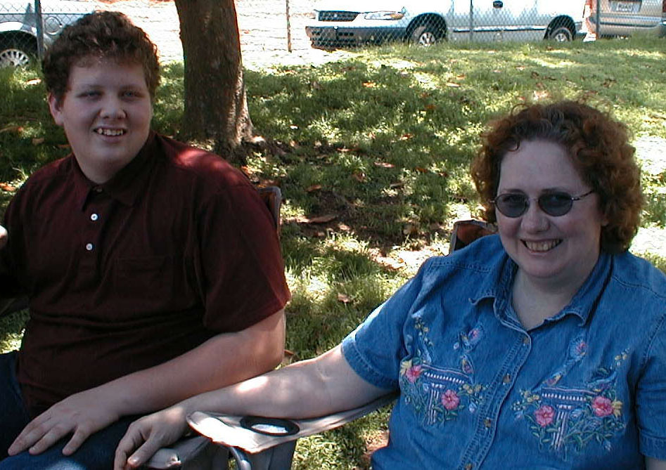 Luke and Cathy resting at the Easter Egg Hunt, April 19, 2003