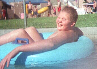 Luke in the lazy river at The Beach (Albuquerque's waterpark) during the annual New Mexico Autism Society's pool party.   August 16, 1998