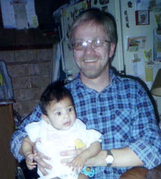 Jeff holding his niece Victoria.  She's Craig and Lisa's second, 4-months old in this picture in Wildwood, New Jersey, December, 1999