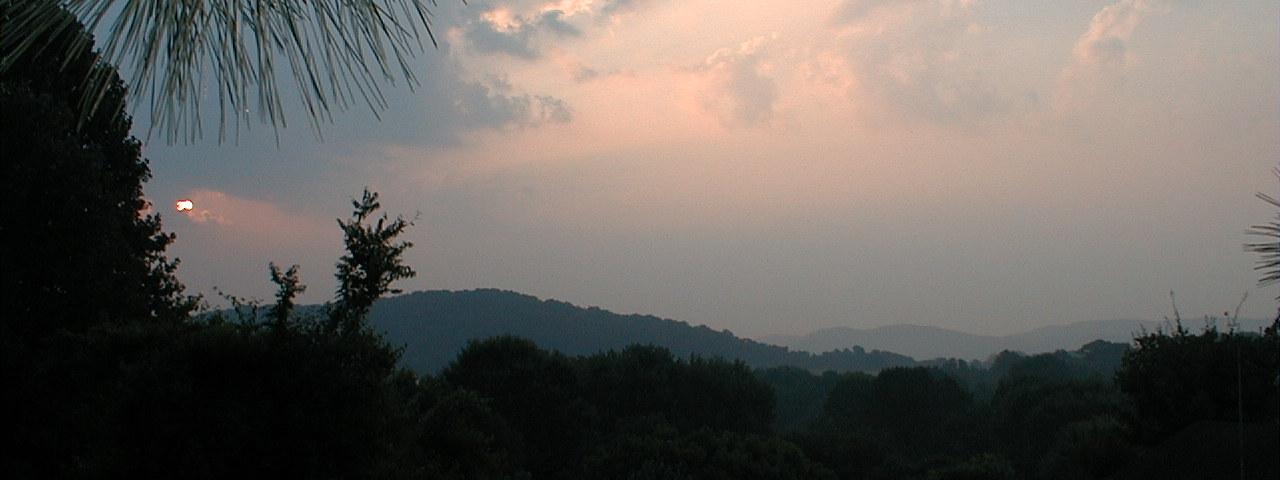 Sunrise over the Smokies, looking East, Northeast from our back yard, July 10, 2000