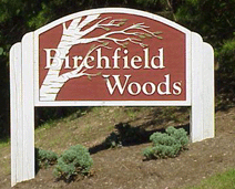 Picture of sign at entrance to cluster reading "Birchfield Woods"