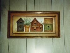 framed painting of birdhouses