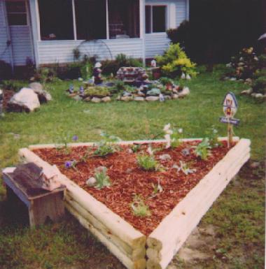 triangular shaped raised flower garden