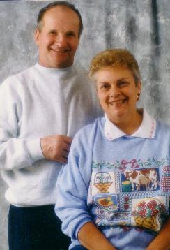 photo of a blonde lady in blue sweatshirt and man in white shirt.