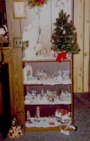 bookcase of Christmas houses