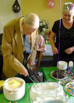 Poppa cutting the cake