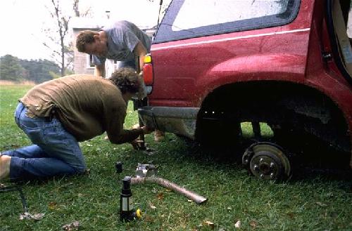 Steve just after almost being crushed by Explorer after fixing tailpipe