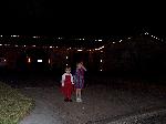 Jordan and Jada in front of the house with lights