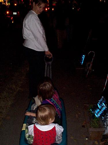 Girls snuggling in the wagon