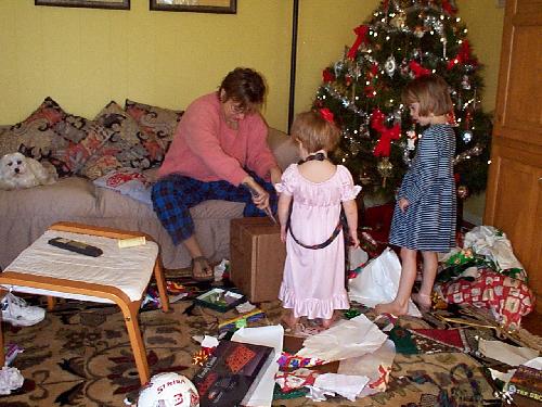 Mama opening something big for the girls