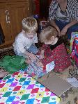 and Mason helps her open - a cool wind-up train!