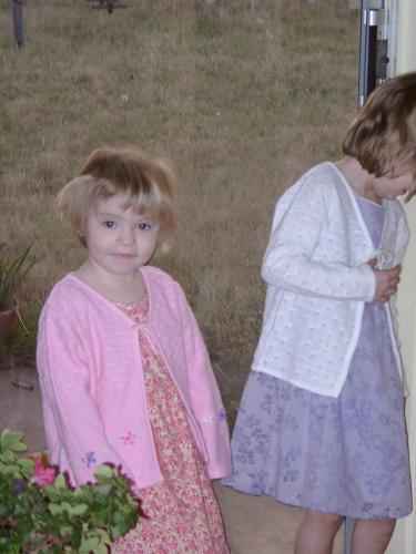 ...a picture where both girls are smiling and looking at the camera.