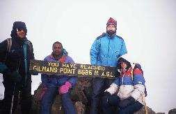 Gilman's Point, Mt. Kilimanjaro, 5685 m, Tanzania. 2nd on the left is our local guide, and on the right two friends of the A.N.M. Kili 96 group