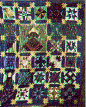 photo of quilt with off-center angel medallion