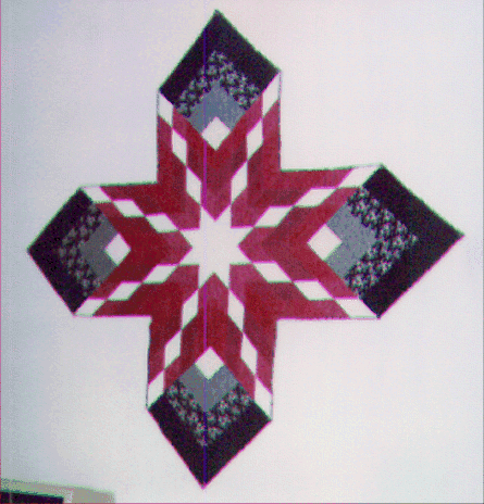 cross wall hanging with center medallion
in the form of a star