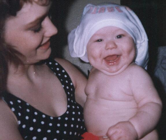 Billy with his shirt over his head, and a big toothless smile at 6 months old